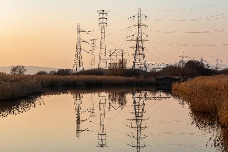 Photo of power lines over a river