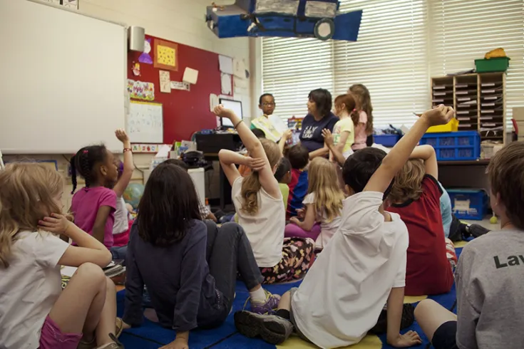 Young school children in a class room learning