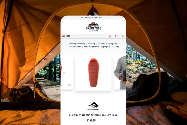 Mobile view of the countryside site on a background of a view from inside a tent.