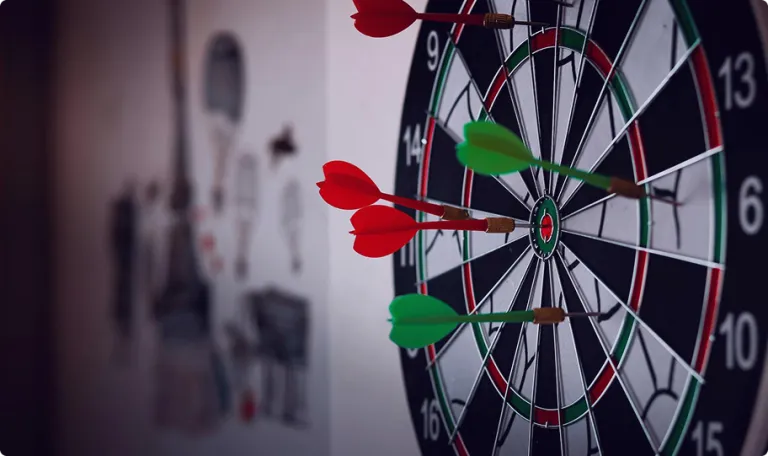 Close up of darts in a dartboard