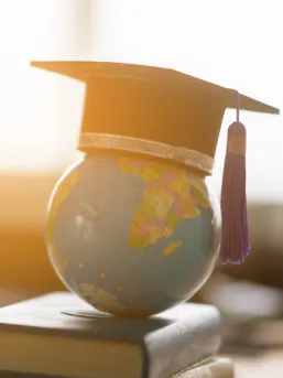 Globe with a graduation cap