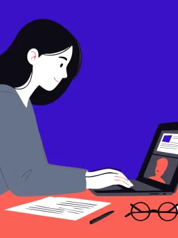 Person working at a laptop during an online meeting