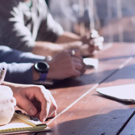 Image of hands resting on a desk