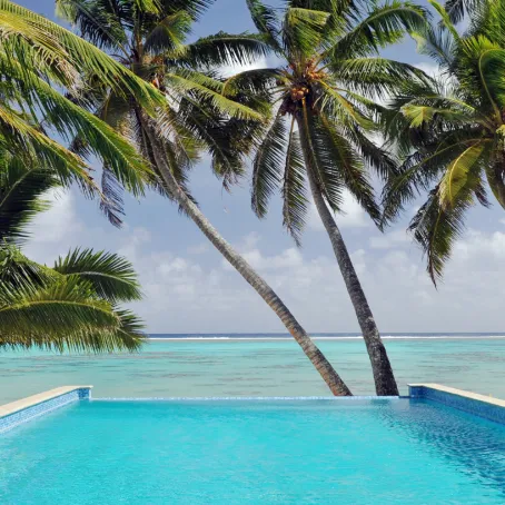 A luxury hotel pool overlooking the ocean