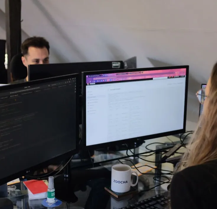 Kimberley working, looking at two monitors
