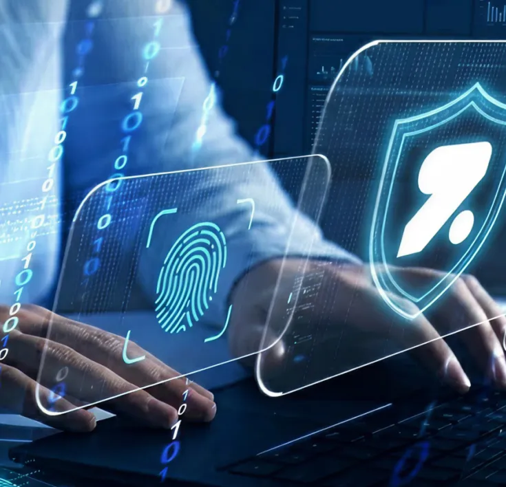 A person typing at a futuristic keyboard and screen