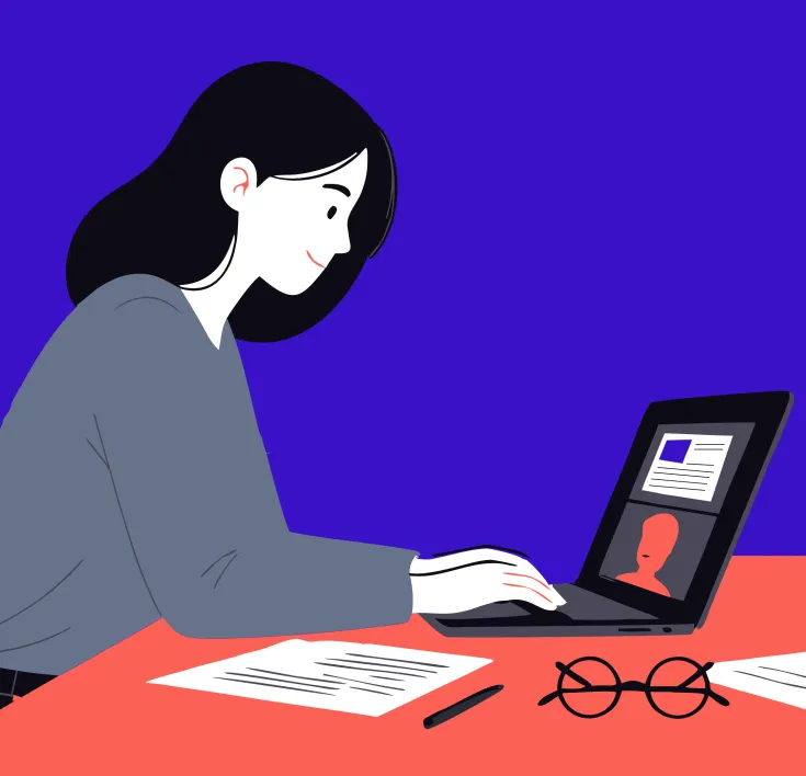 Person working at a laptop during an online meeting
