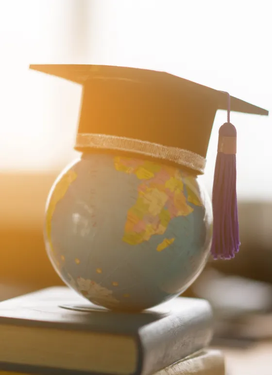 Globe with a graduation cap