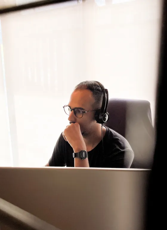 Uesli working behind a monitor