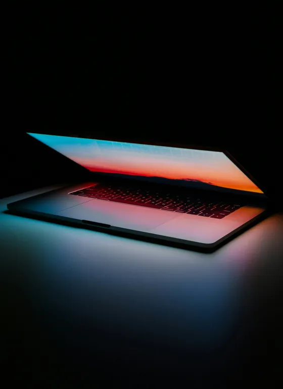 Laptop glowing - dark background