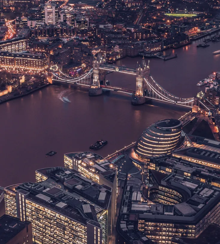 Birdseye view of London and the river Thames at night