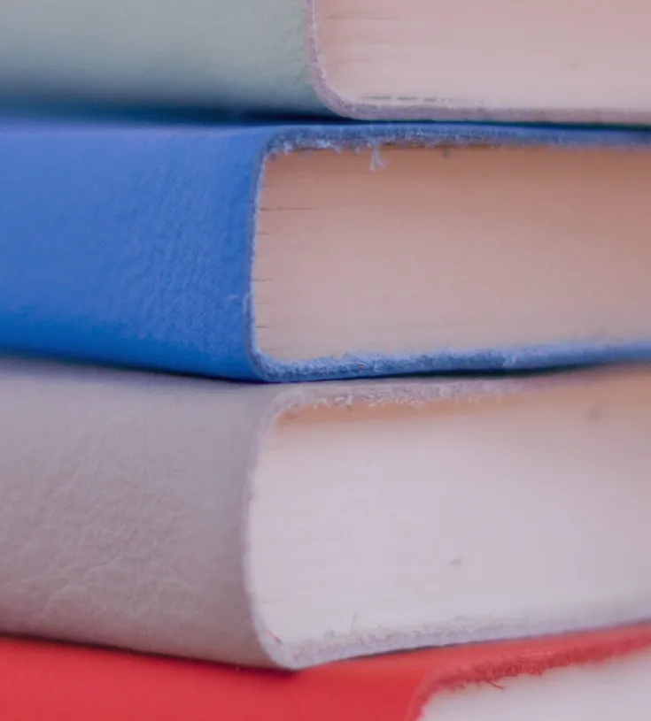 Close up of a pile of books