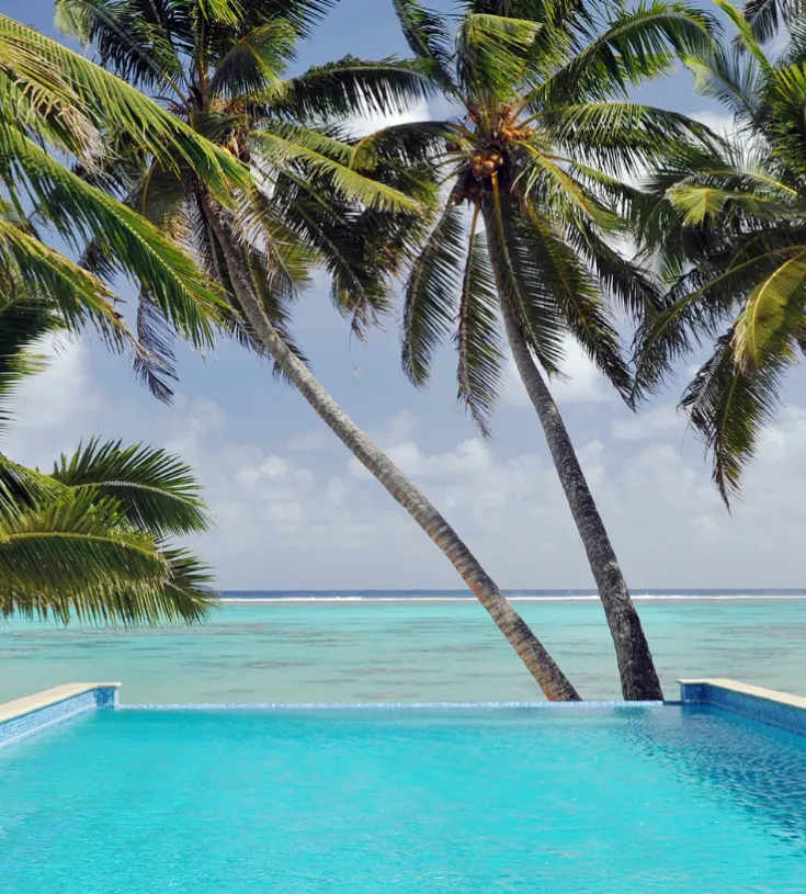 A luxury hotel pool overlooking the ocean