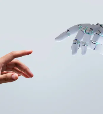 Robot and human hand reaching out together
